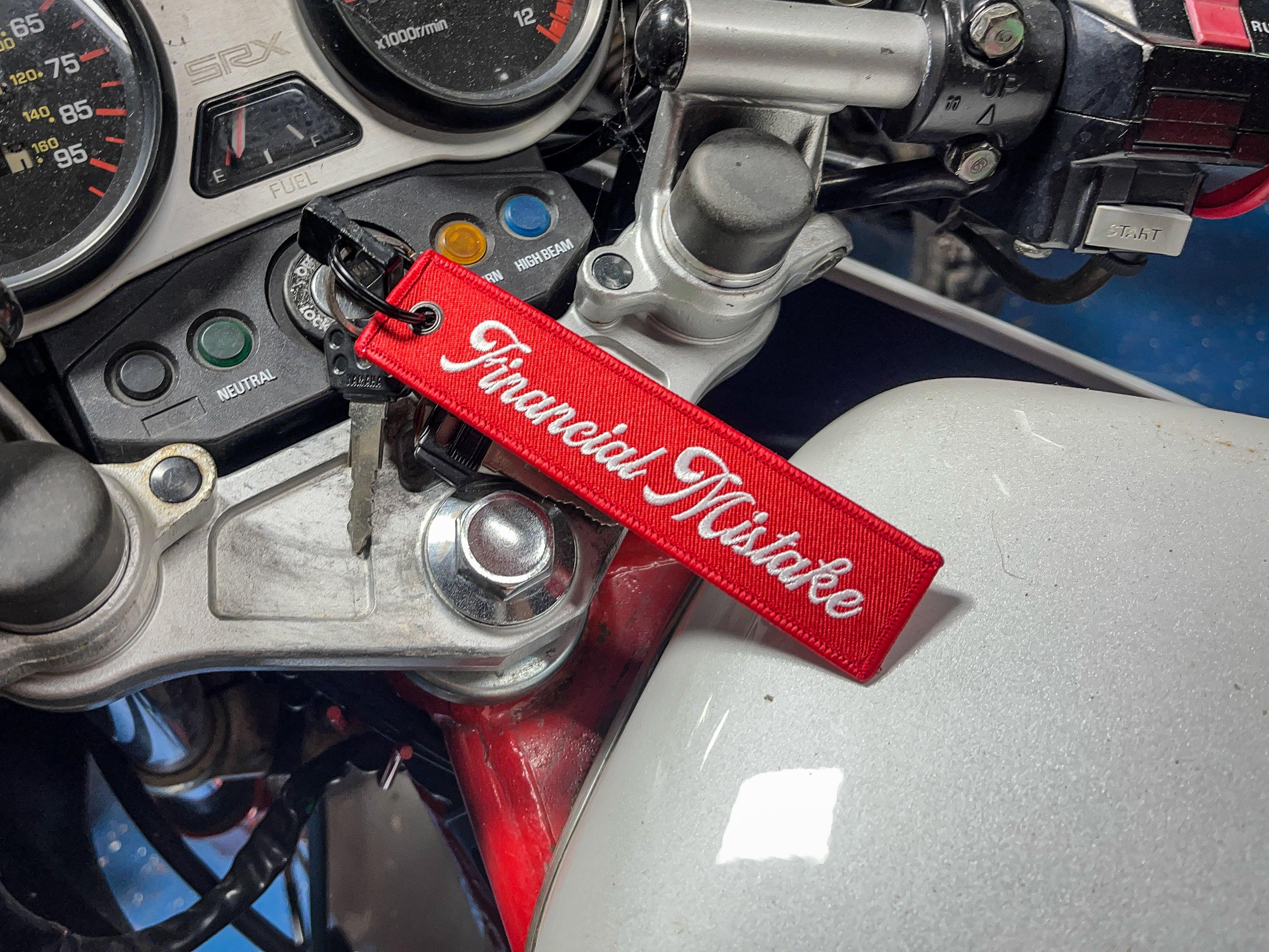 Financial Mistake Jet Tag Keychain | Red |.