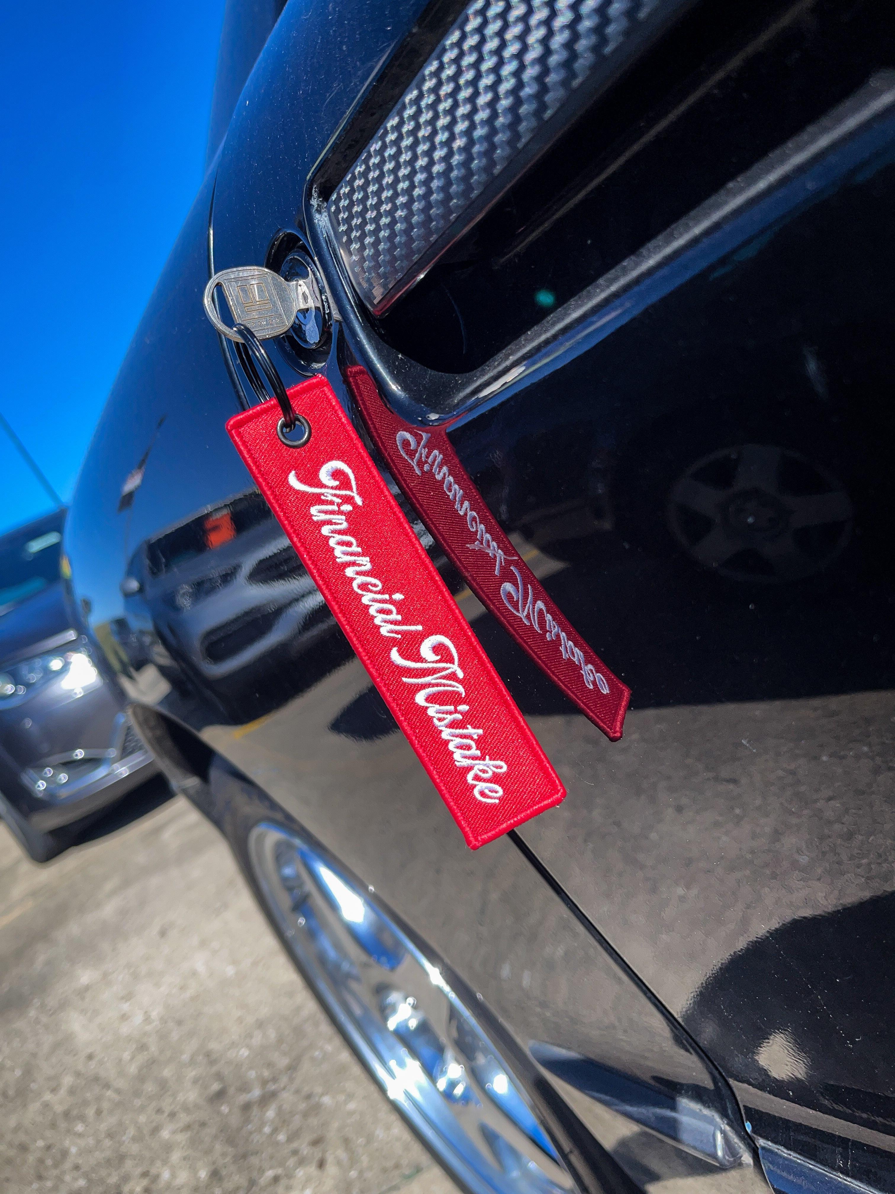 Financial Mistake Jet Tag Keychain | Red |.